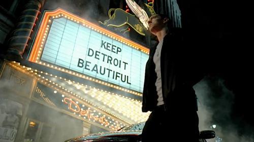 Eminem looking at marquee saying "Keep Detroit Beautiful"